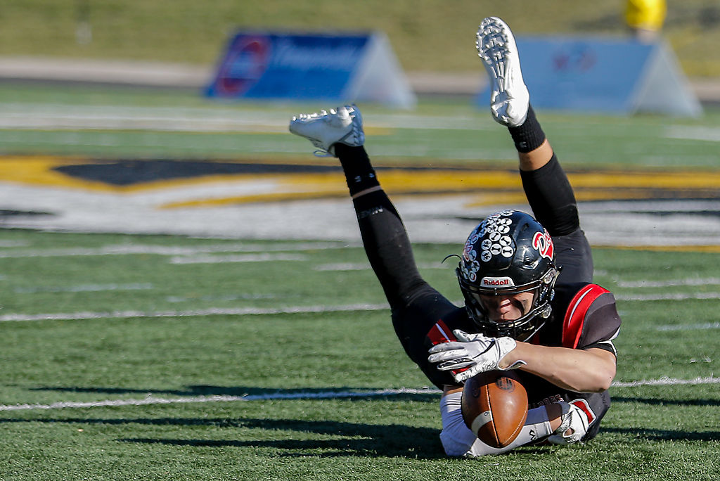 Odessa wide receiver Caleb Cremeen grasps for control of the ball